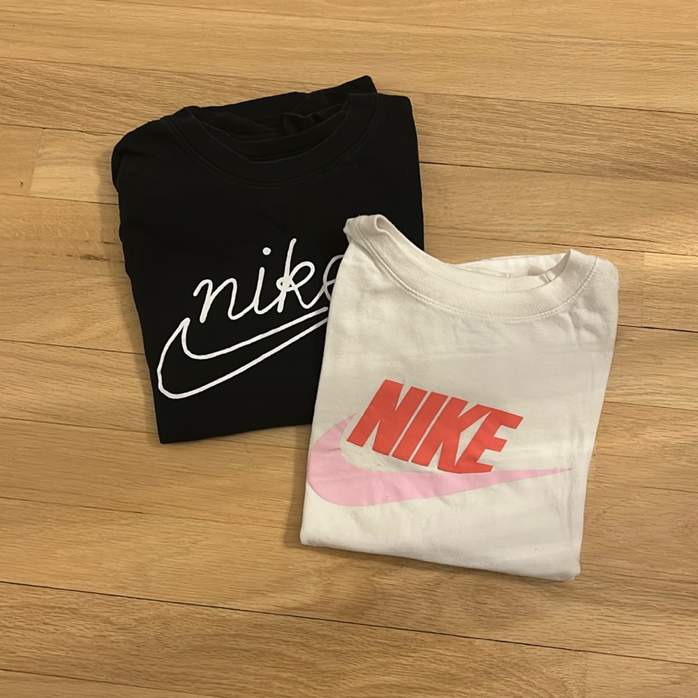 Two girl Nike short sleeve t-shirts in sizes S/M